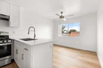 San Ysidro apartment for rent - A kitchen with white cabinets and a stainless steel oven.