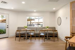 Escondido apartment for rent - A modern dining area with a long table and chairs.