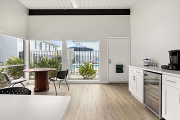 San Diego apartment for rent - A kitchen with a table and chairs is shown.