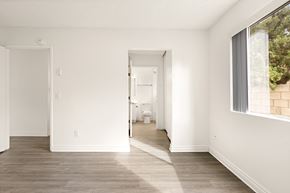 El Cajon apartment for rent - A white room with a doorway leading to another room.