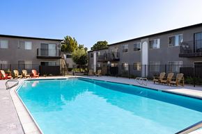 El Cajon apartment for rent - A swimming pool in front of apartment buildings.