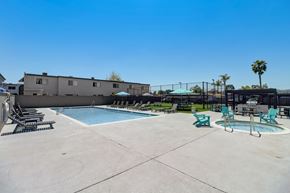 El Cajon apartment for rent - A pool area with a hot tub and lounge chairs.