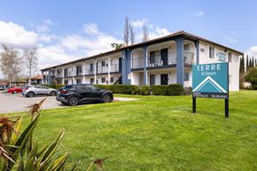 Ramona apartment for rent - A building with the sign