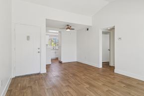 Ramona apartment for rent - A room with a white door and a wooden floor.