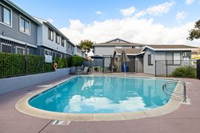 El Cajon apartment for rent - A swimming pool in a residential area with a sign that says
