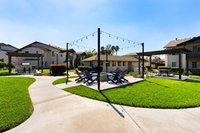 El Cajon apartment for rent - A park with a bench and a swing set.