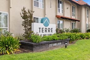 El Cajon apartment for rent - A sign for Terre at Nollison in front of a building.