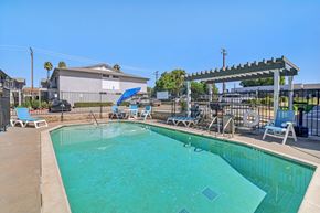 Ramona apartment for rent - A swimming pool with a blue tarp covering the top.