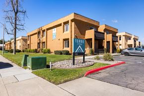 Ramona apartment for rent - A building with a sign that says "TERRE" in front of it.
