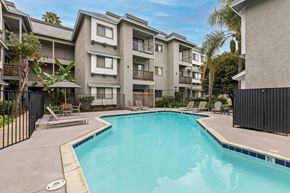 San Diego apartment for rent - A swimming pool in front of apartment buildings.