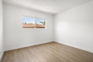Spring Valley apartment for rent - A room with a window showing a view of a building outside.
