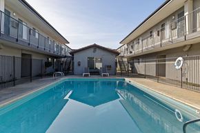 Spring Valley apartment for rent - A swimming pool in a residential area surrounded by apartment buildings.