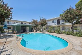 Spring Valley apartment for rent - A round above ground pool with a metal fence around it.