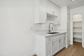 Escondido apartment for rent - A white kitchen with a sink and cabinets.