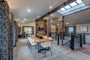 Lynnwood apartment for rent - A modern dining room with a wooden table and chairs.