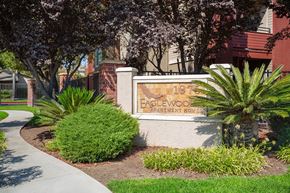 Woodland apartment for rent - A sign for Eaglewood Apartment Homes is displayed in front of a building.