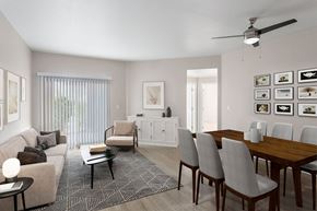 Woodland apartment for rent - A living room with a couch, chairs, and a dining table.