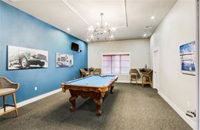 Modesto apartment for rent - A room with a pool table and a chair.