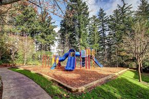 Gresham apartment for rent - A playground with a blue slide and a yellow slide.