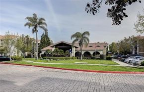 Turlock apartment for rent - A building with a red brick walkway in front of it.