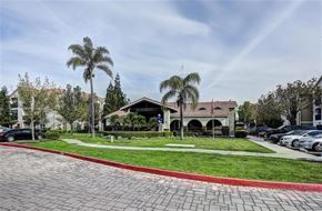 Turlock apartment for rent - A building with a red brick walkway in front of it.