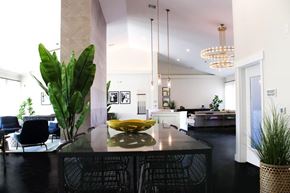 Stockton apartment for rent - A modern kitchen with a black table and chairs.