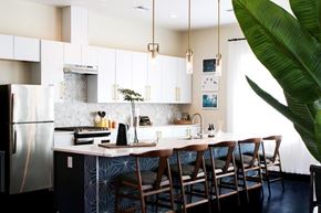 Stockton apartment for rent - A kitchen with a large island and chairs.