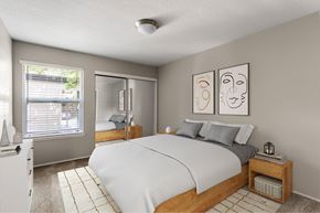 Portland apartment for rent - A bedroom with a bed, nightstand, and two framed pictures on the wall.