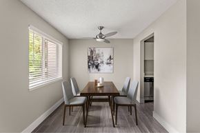 Tumwater apartment for rent - A dining room with a wooden table and chairs.