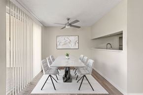 University Place apartment for rent - A dining room with a white table and chairs.