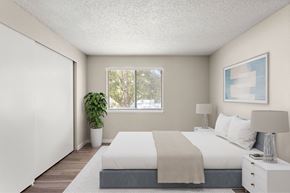 University Place apartment for rent - A bedroom with a large bed and a potted plant.