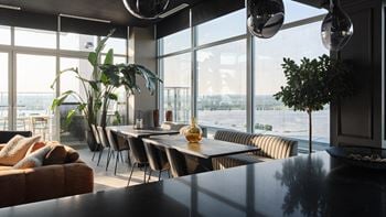 A modern dining room with a view of the city.