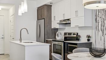 Modern kitchen with white cabinets and island