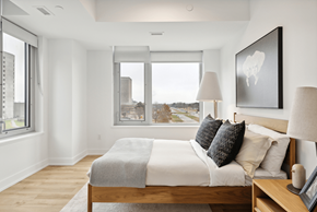 Ottawa apartment for rent - A bedroom with a large bed and a view of the city at The Dale Apartments , Ottawa