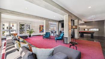 Modern open concept living room with pool table