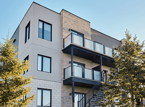 Gatineau apartment for rent - A modern building with a balcony and a staircase.