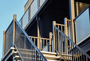 Gatineau apartment for rent - A wooden staircase with a metal railing.