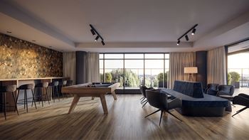 Modern lounge with pool table and seating