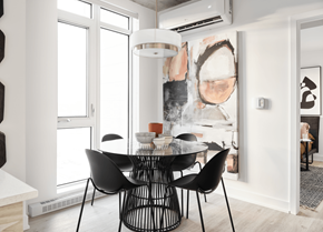 Gatineau apartment for rent - A modern dining room with a large abstract painting on the wall.