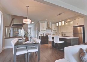 Gatineau apartment for rent - A modern kitchen with a dining table and chairs.
