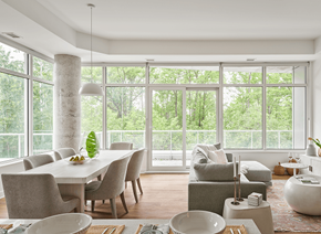 Ottawa apartment for rent - A modern dining room with a table set for two and a view of the trees outside at Petries Landing I Apartments , Ottawa, ON