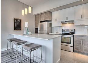 Gatineau apartment for rent - A modern kitchen with a white countertop and stainless steel appliances.