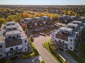 Gatineau apartment for rent - A bird's eye view of a residential area with multiple apartment buildings and a parking lot.