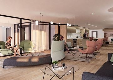 Gatineau apartment for rent - A woman is sitting on a green chair in a modern living room.