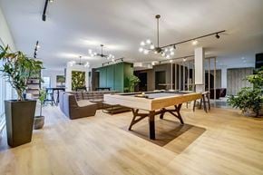 Gatineau apartment for rent - A room with a pool table and a billiard table.