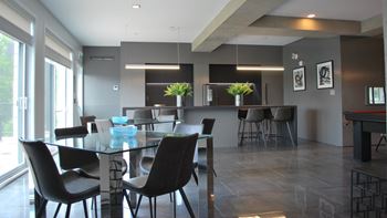 Open concept dining area with glass table
