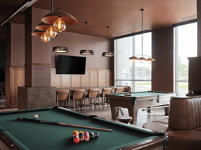 Ottawa apartment for rent - A pool table with a green felt cloth and a television mounted on the wall at The Dale Apartments , Ontario, K1Y 4Y5