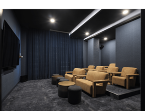 Ottawa apartment for rent - A dark cinema room with rows of seats and a screen on the left at The Dale Apartments , Ottawa, ON