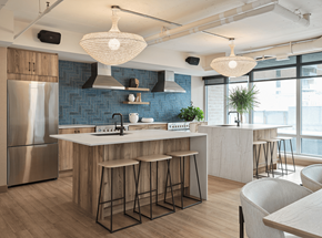 Ottawa apartment for rent - A modern kitchen with a large island and bar stools at The Dale Apartments , Ottawa, K1Y 4Y5