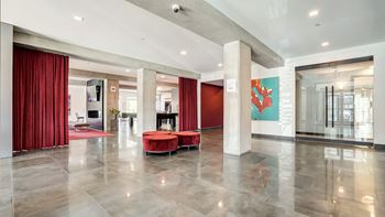 Modern lobby with red curtains and seating